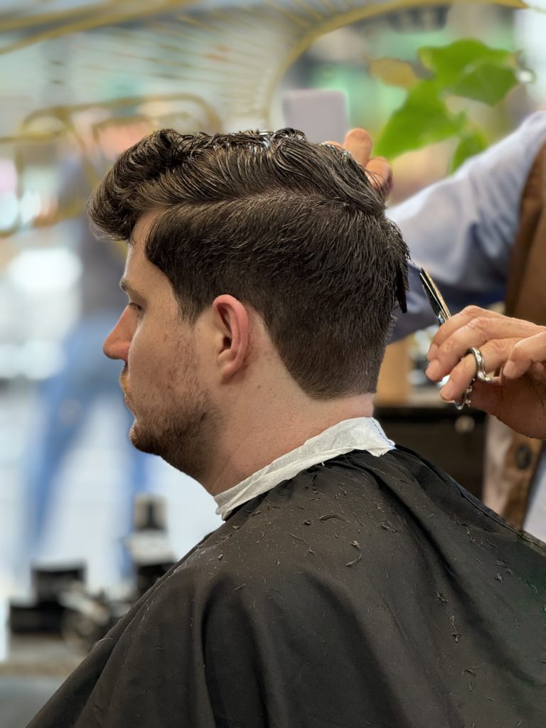a man getting his hair cut